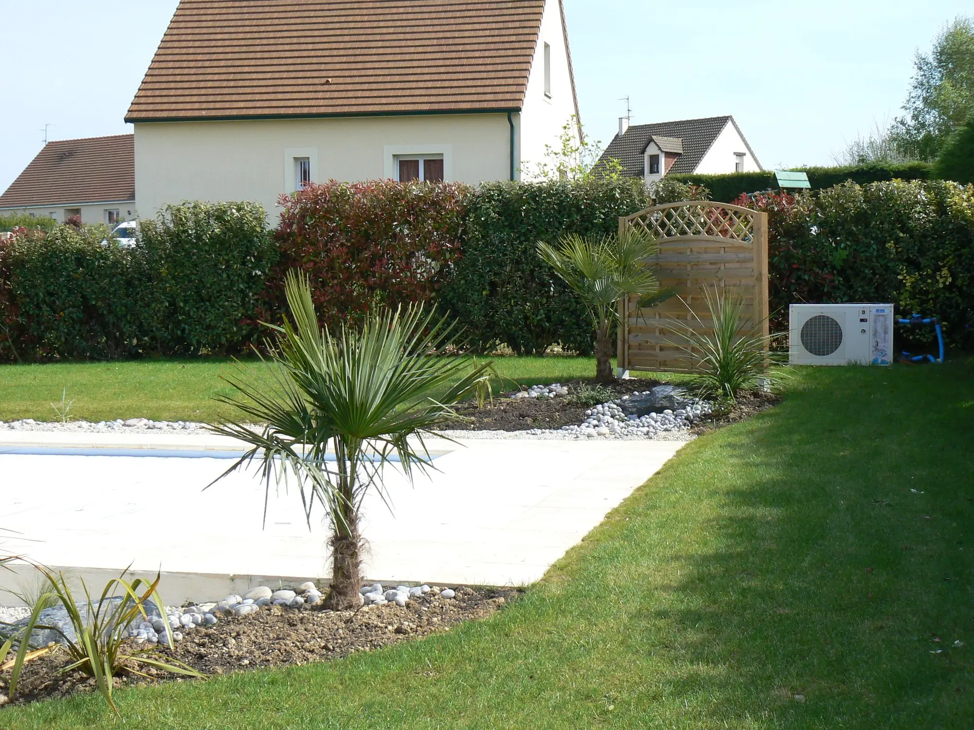 Wide view of a completed pool and villa