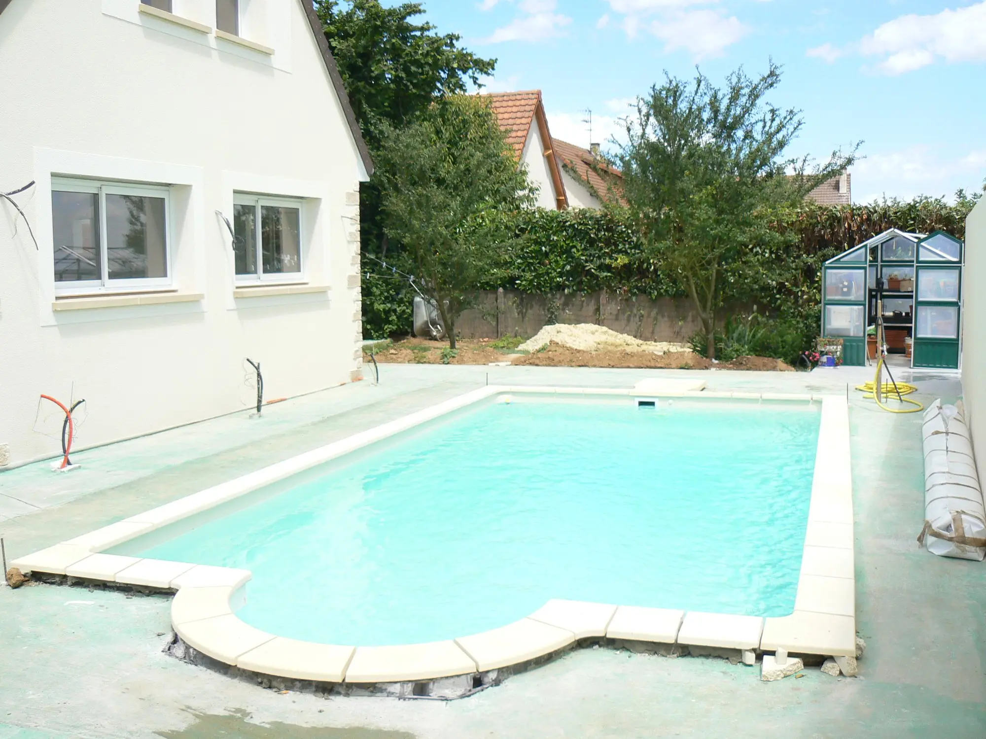 Finished pool with terrace and villa