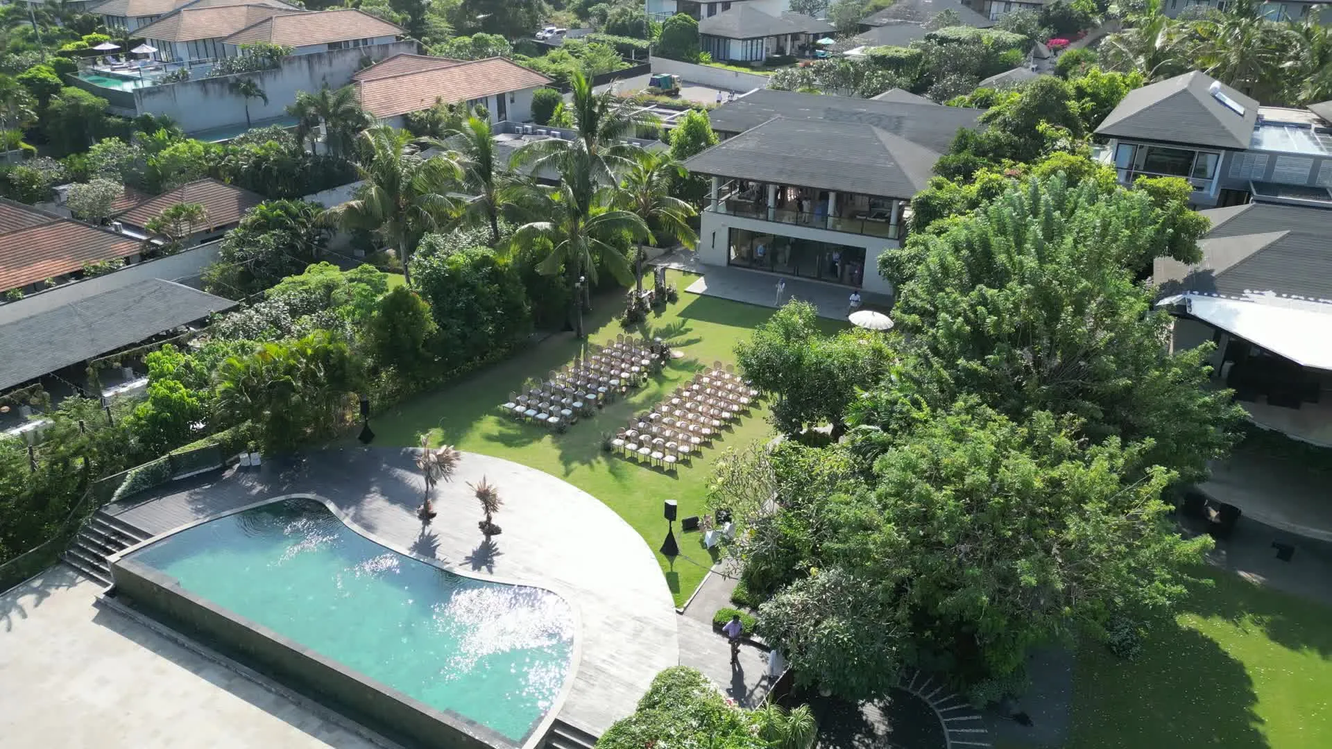 Aerial view of a luxury tropical villa with pool